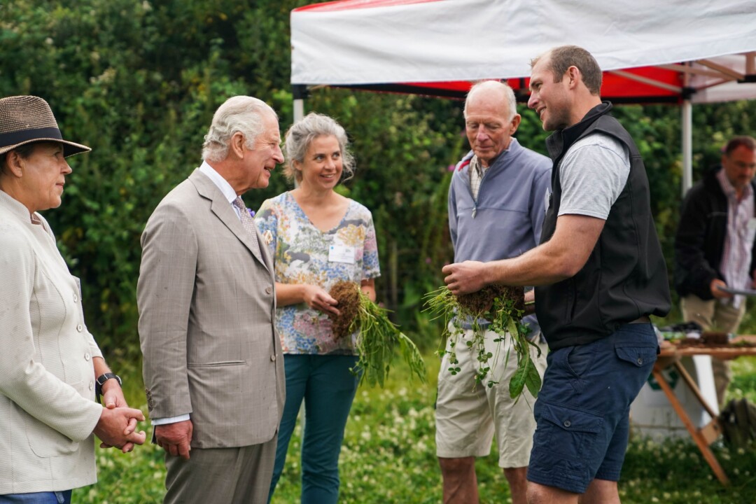 King Charles III talking to gardeners